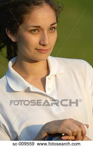 Portrait of a young female golfer View Large Photo Image Stock Photo - Portrait of a young female golfer. Fotosearch