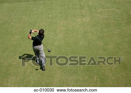 Stock Image - High angle view of a man playing a golf stroke. Fotosearch