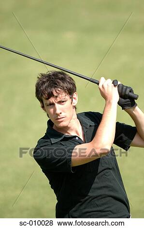 Portrait of a man playing a golf stroke View Large Photo Image Stock Photo - Portrait of a man playing a golf stroke. Fotosearch