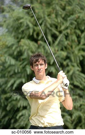Portrait of a man playing a golf stroke View Large Photo Image Stock Photograph - Portrait of a man playing a golf stroke. Fotosearch