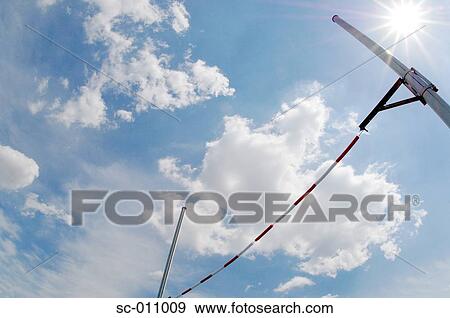 Stock Photo - High Jump Bar Glistening In the Sun. Fotosearch
