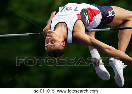 Male High Jumper Clearing the Bar View Large Photo Image Stock Photography - Male High Jumper Clearing the Bar. Fotosearch