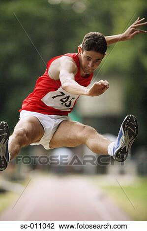 Male Long Jumper Leaping View Large Photo Image Stock Image - Male Long Jumper Leaping. Fotosearch