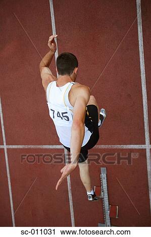 Male Runner Leaping Off Starting Blocks View Large Photo Image Stock Image - Male Runner Leaping Off Starting Blocks. Fotosearch