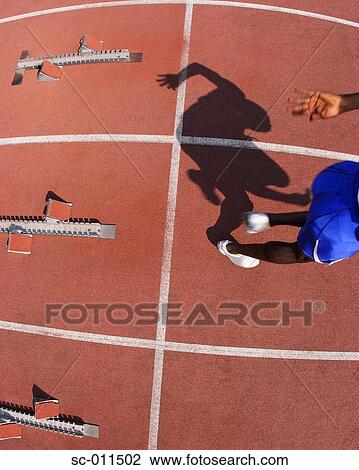 Male Runner Leaping Off Starting Blocks View Large Photo Image Stock Image - Male Runner Leaping Off Starting Blocks. Fotosearch