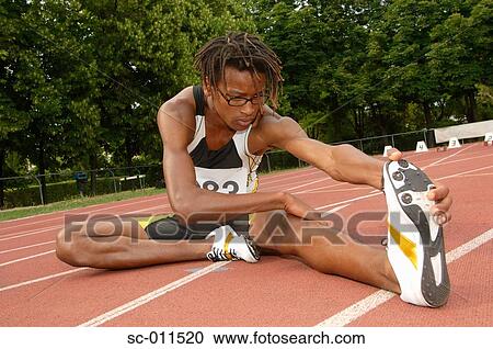 Stock Image - Male Runner Stretching. Fotosearch