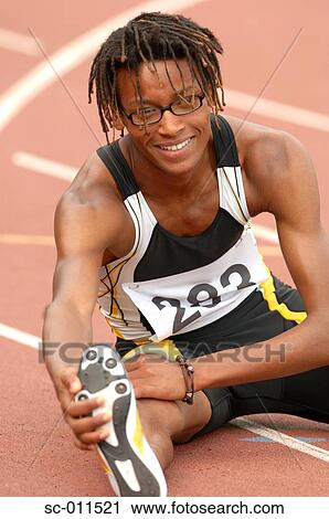 Stock Image - Male Runner Stretching. Fotosearch