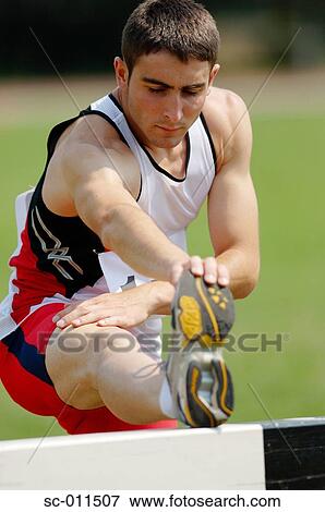 Stock Photo - Male Runner Stretching. Fotosearch