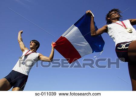 Stock Photo - Male Runners Carrying French Flag. Fotosearch