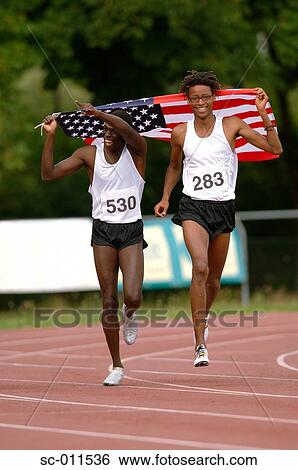 Male Runners Carrying US Flag View Large Photo Image Stock Photograph - Male Runners Carrying US Flag. Fotosearch