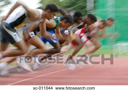 Picture - Male Runners Leaping Off Starting Blocks. Fotosearch
