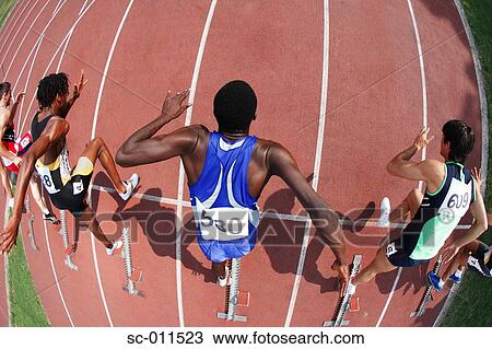 Male Runners Leaping Off Starting Blocks View Large Photo Image Stock Image - Male Runners Leaping Off Starting Blocks. Fotosearch