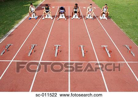 Male Runners Lined Up on Starting Blocks View Large Photo Image Stock Image - Male Runners Lined Up on Starting Blocks. Fotosearch