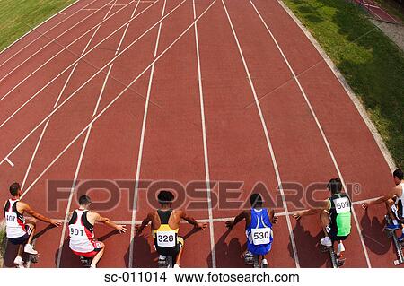 Picture - Male Runners Sprinting Down Track. Fotosearch
