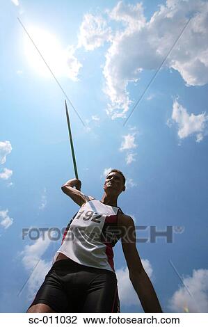 Man Hurling a Javelin View Large Photo Image Stock Image - Man Hurling a Javelin. Fotosearch