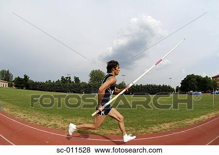 Stock Photo - Man Pole Vaulting. Fotosearch