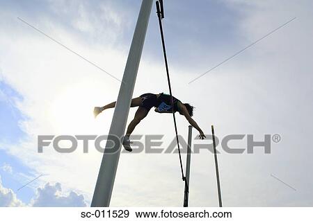 Stock Photo - Man Pole Vaulting. Fotosearch
