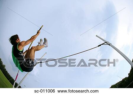 Stock Photograph - Man Pole Vaulting. Fotosearch