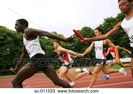Relay Runners Passing Baton View Large Photo Image Stock Image - Relay Runners Passing Baton. Fotosearch