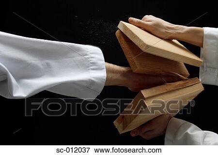 Blackbelt Breaking Boards View Large Photo Image Stock Photo - Blackbelt Breaking Boards. Fotosearch