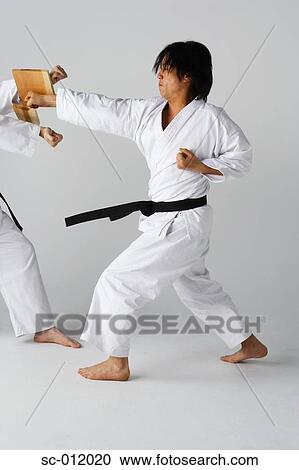 Stock Image - Blackbelt Doing a Front Kick. Fotosearch