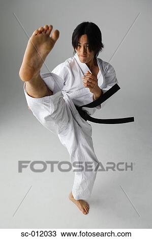 Blackbelt Doing a Front Kick View Large Photo Image Stock Image - Blackbelt Doing a Front Kick. Fotosearch
