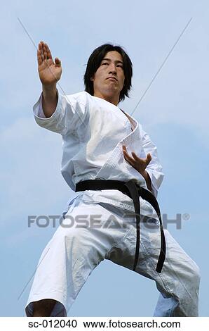 Stock Image - Blackbelt In An At Ready Stance. Fotosearch