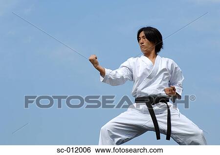 Stock Photograph - Blackbelt In An At Ready Stance. Fotosearch