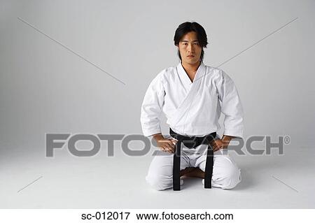 Stock Photo - Blackbelt Kneeling. Fotosearch