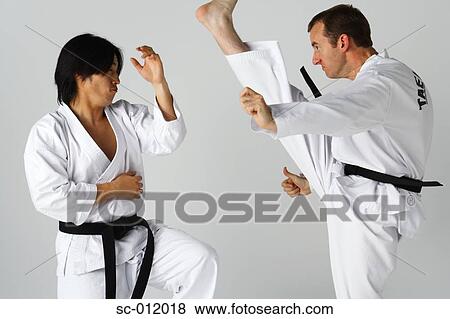 Stock Photo - Two Blackbelts Sparring. Fotosearch