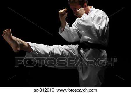 Stock Photo - Two Blackbelts Sparring. Fotosearch