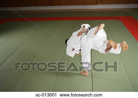 Stock Image - Two Men Competing in a Judo Match. Fotosearch