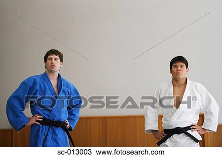 Stock Image - Two Men Competing in a Judo Match. Fotosearch