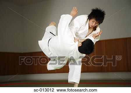 Stock Image - Two Men Competing in a Judo Match. Fotosearch