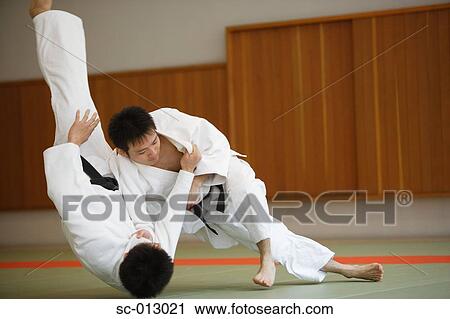 Stock Image - Two Men Competing in a Judo Match. Fotosearch