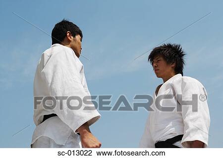 Stock Image - Two Men Competing in a Judo Match. Fotosearch