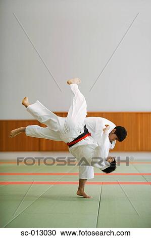 Stock Image - Two Men Competing in a Judo Match. Fotosearch