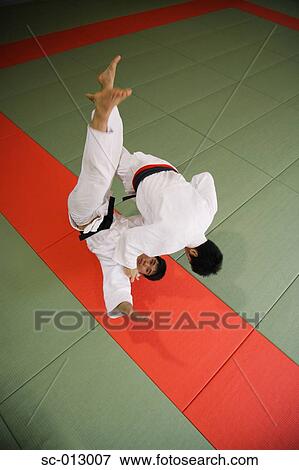 Stock Photo - Two Men Competing in a Judo Match. Fotosearch