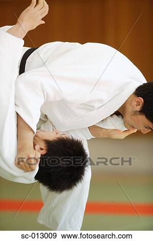 Stock Photo - Two Men Competing in a Judo Match. Fotosearch