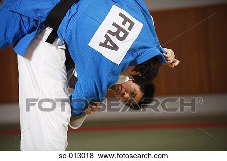 Stock Photo - Two Men Competing in a Judo Match. Fotosearch