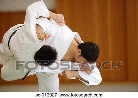 Stock Photo - Two Men Competing in a Judo Match. Fotosearch