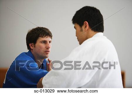 Stock Photo - Two Men Competing in a Judo Match. Fotosearch