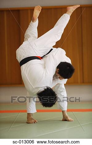 Stock Photograph - Two Men Competing in a Judo Match. Fotosearch