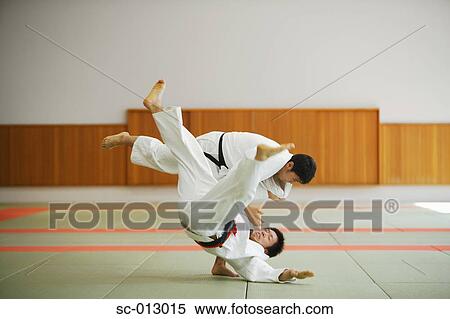 Stock Photography - Two Men Competing in a Judo Match. Fotosearch