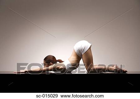 Young Asian woman in Full One-Legged King Pigeon yoga position View Large Photo Image Stock Photo - Young Asian woman in Full One-Legged King Pigeon yoga position. Fotosearch
