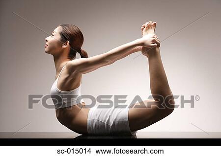 Picture - Young Asian woman in yoga position. Fotosearch