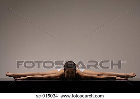 Picture - Young Asian woman in yoga position. Fotosearch