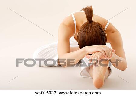 Young Asian woman in yoga position View Large Photo Image Stock Photo - Young Asian woman in yoga position. Fotosearch