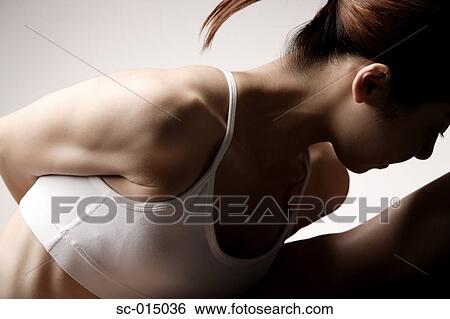Young Asian woman in yoga position View Large Photo Image Stock Photograph - Young Asian woman in yoga position. Fotosearch