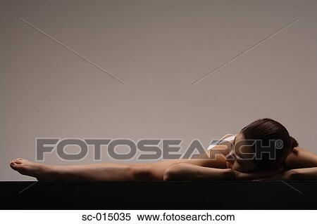 Young Asian woman in yoga position View Large Photo Image Stock Photography - Young Asian woman in yoga position. Fotosearch